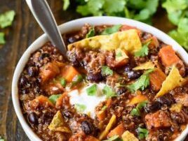 A healthy and hearty slow cooker turkey quinoa chili with sweet potatoes, black beans, and warm spices. Easy to make, great leftover, and healthy too! PREP: 10 mins COOK: 5 hrs 5 mins TOTAL: 5 hrs 15 mins SERVINGS: 6 servings Ingredients 1 tablespoon extra virgin olive oil 1 pound lean ground turkey 1 large yellow onion chopped 1 teaspoon kosher salt 1 teaspoon garlic powder 1/2 teaspoon black pepper 1 tablespoon chili powder 2 teaspoons chipotle chili pepper 2 teaspoons cumin 3 small sweet potatoes (or 2 large) peeled and diced (about 1 pound) 1 cup uncooked quinoa 1 can crushed tomatoes (28 ounces) 1 can black beans (15 ounces) rinsed and drained 1 can beer (12 ounces) I used an IPA; any dark or amber beer would be great too! or substitute additional low-sodium chicken stock 2-3 cups low-sodium chicken stock For serving: cilantro avocado, shredded cheese, tortilla chips, and sour cream or plain Greek yogurt Instructions Heat the olive oil in a large skillet or Dutch oven over medium high. Add the turkey, onion, salt, garlic powder, and black pepper. Cook and stir, breaking up the turkey as you go, until the turkey is no longer pink, about 5 minutes. Stir in the chili powder, chipotle chili powder, and cumin, then transfer to the bottom a large slow cooker. To the slow cooker, add the chopped sweet potatoes, quinoa, beer, 2 cups chicken stock, crushed tomatoes, and black beans. Cover and cook on high for 3-4 hours or low for 5-6 hours, until the potatoes are tender. Stir in additional chicken stock if the chili is thicker than you would like (I added about 1/2 cup extra). Serve warm with desired toppings. Notes Leftover slow cooker turkey quinoa chili can be stored in the refrigerator for up to 5 days or frozen for up to three months. If you are doubling this recipe it WILL NOT FIT in a 6-quart slow cooker. Borrow a second one, place part in a smaller crock pot, or upgrade to a larger size. You’ve been warned. https://www.wellplated.com/